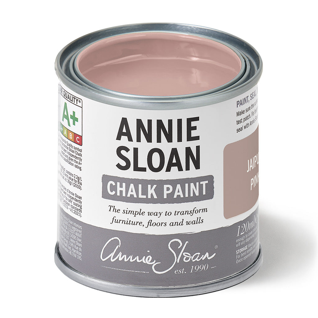 Can of Annie Sloan Chalk Paint with pink interior on a white background
