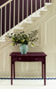 Tyrian Purple painted table against a cream staircase backdrop